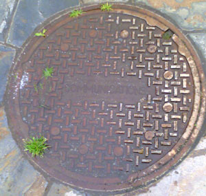 Communications manhole in water fountain at Vancour Washington US